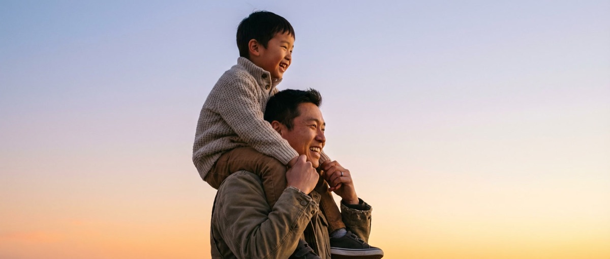 Father and son at sunset